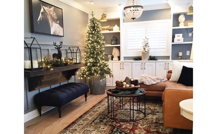 Family room with horse painting and shutters.